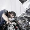 bigstock-auto-mechanic-repairing-a-car--15606254